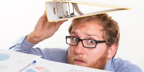 Man with beard hiding under a binder