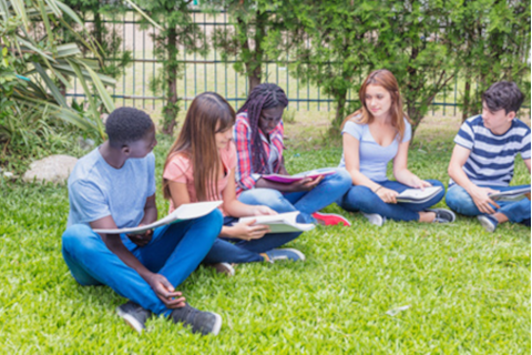 youth sitting on lawn